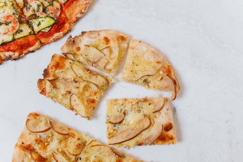 deweys pizza team crafting handmade pizzas with fresh ingredients